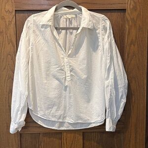 Cite a white cotton blouse